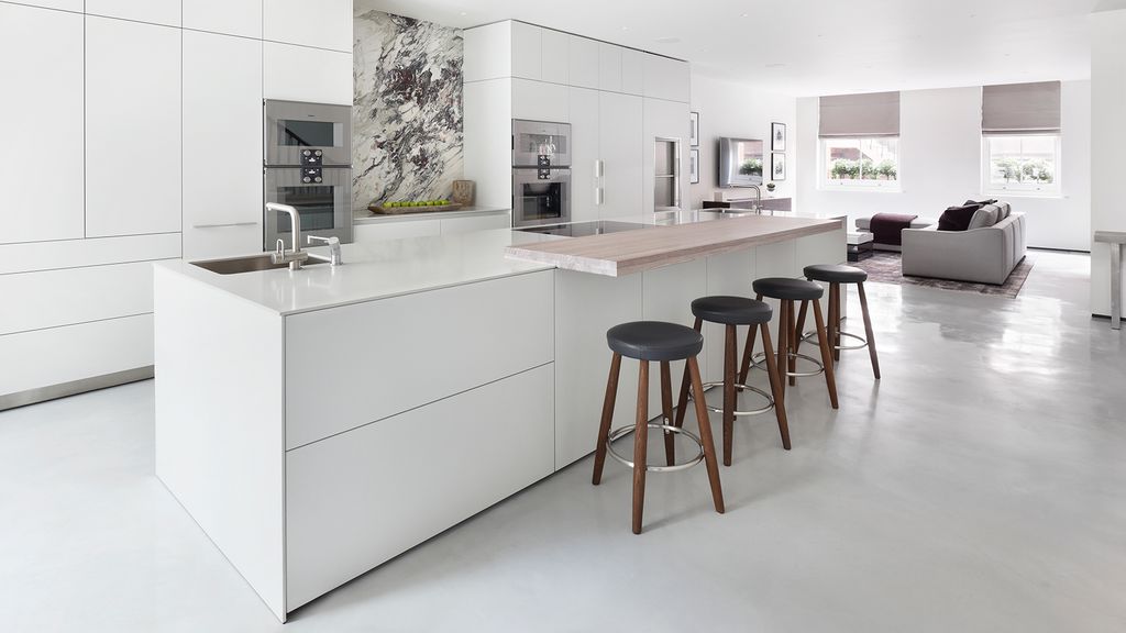 Image may contain Furniture Indoors Room Kitchen Island Bar Stool Kitchen and Sink Faucet