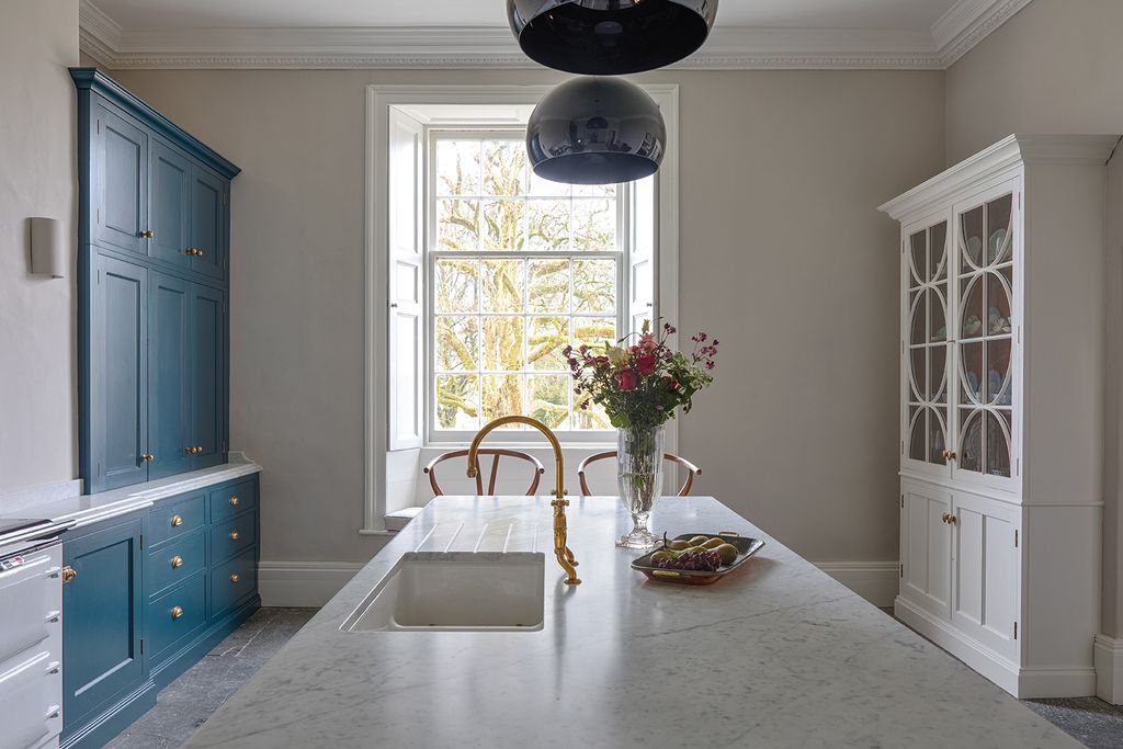 Image may contain Interior Design Indoors Flooring Room Floor Plant Flower Blossom and Living Room