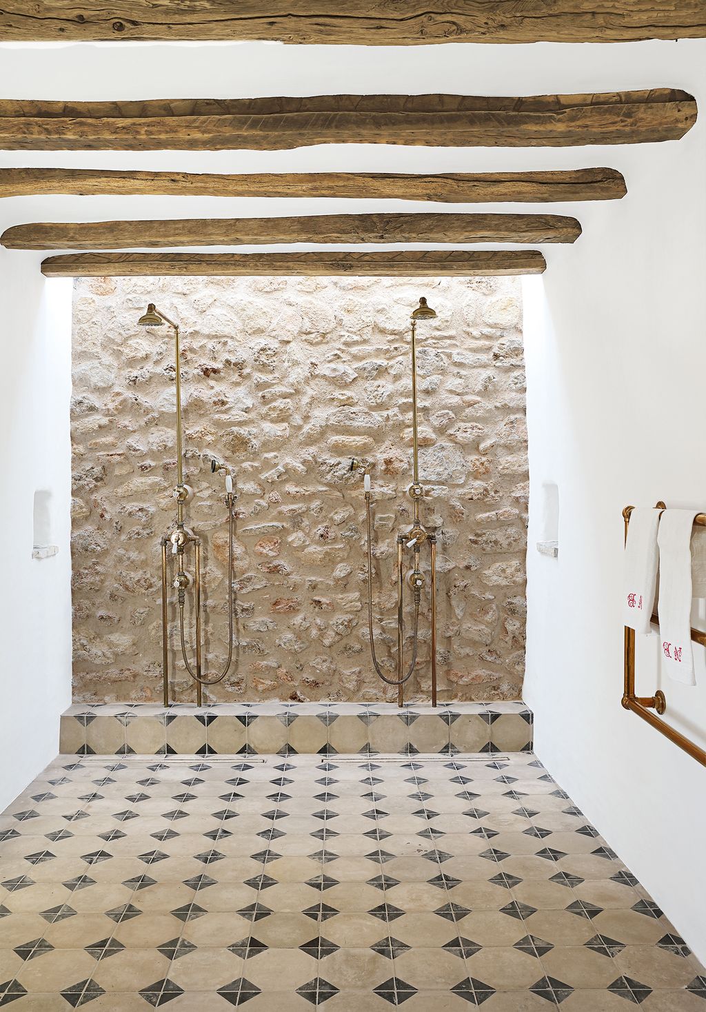 Reclaimed Spanish tiles from Bert May provide pattern in the wet room.