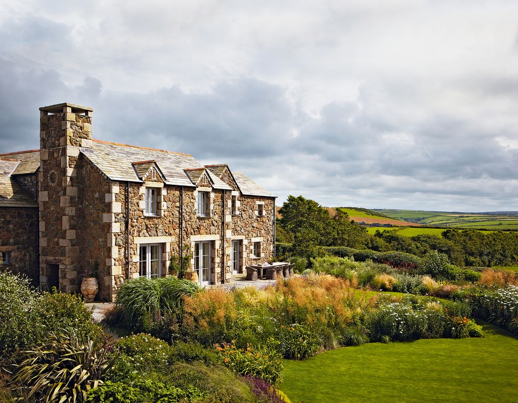 Image may contain Grass Plant Building Housing Mansion House Architecture and Cottage