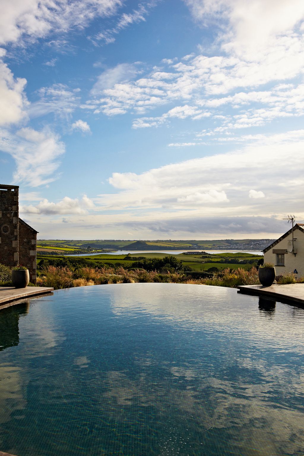 Image may contain Building Housing Outdoors Nature House Countryside Water Shelter Rural and Hut
