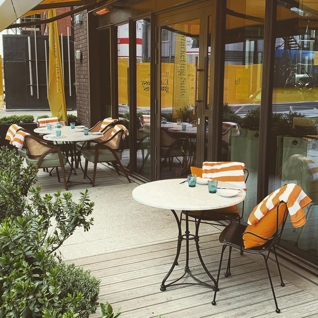 Image may contain Restaurant Furniture Chair Cafe Cafeteria Table and Dining Table