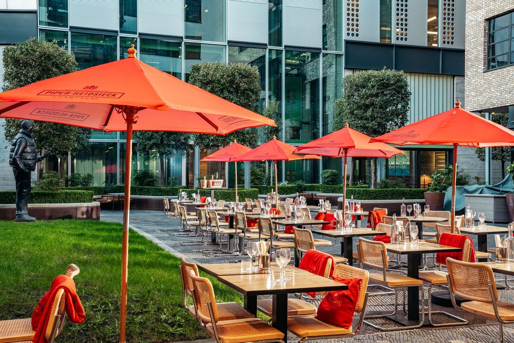 Image may contain Furniture Chair Human Person Restaurant Cafe Cafeteria Food Court and Food