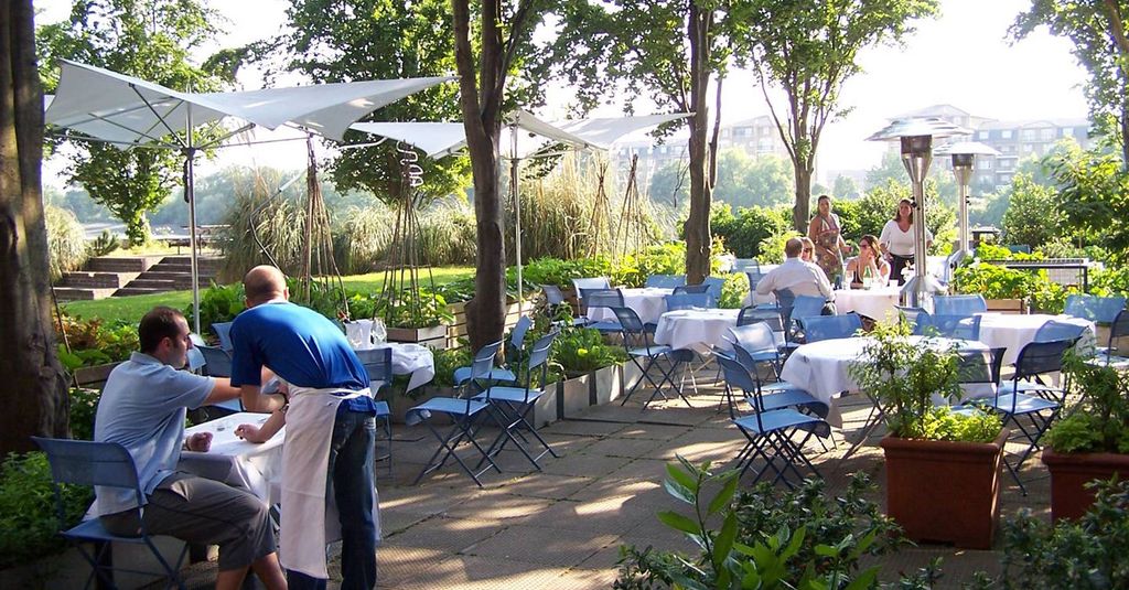 Image may contain Human Person Furniture Chair Restaurant Building and Patio