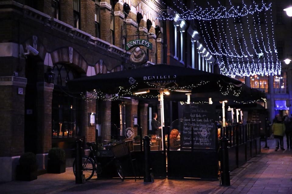 Image may contain Human Person Wheel Machine Restaurant Cafe Vehicle Transportation Bicycle Bike and Cafeteria