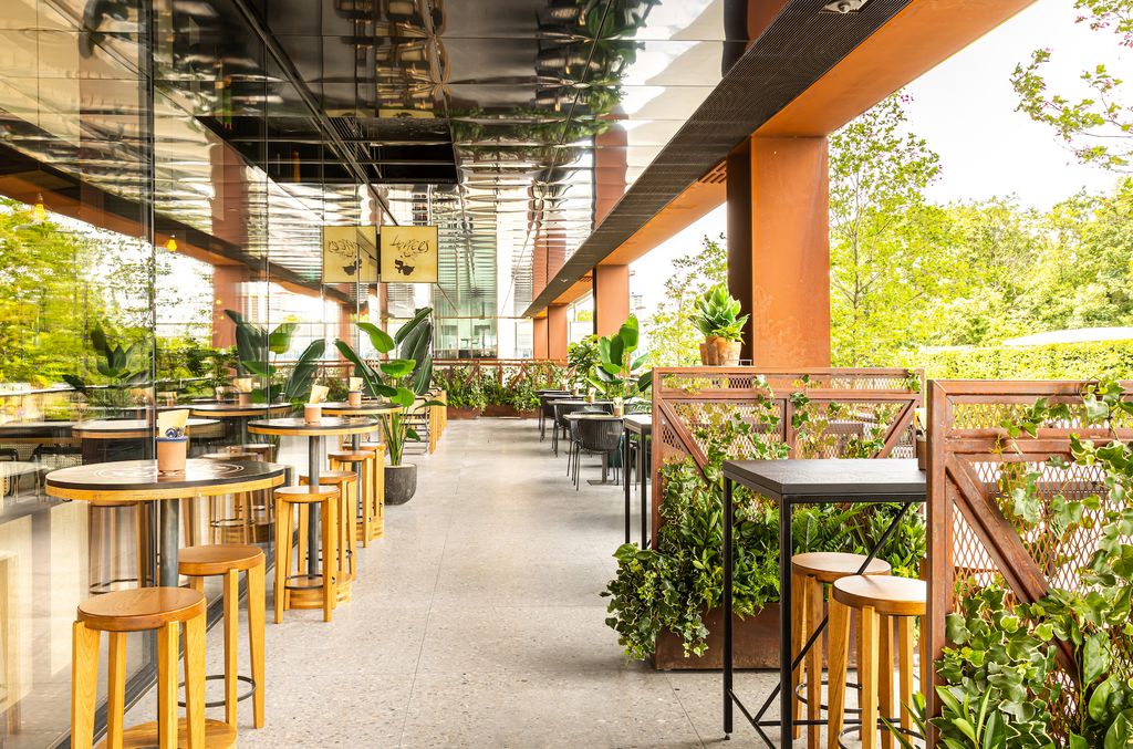 Image may contain Restaurant Furniture Cafeteria Bar Stool and Cafe