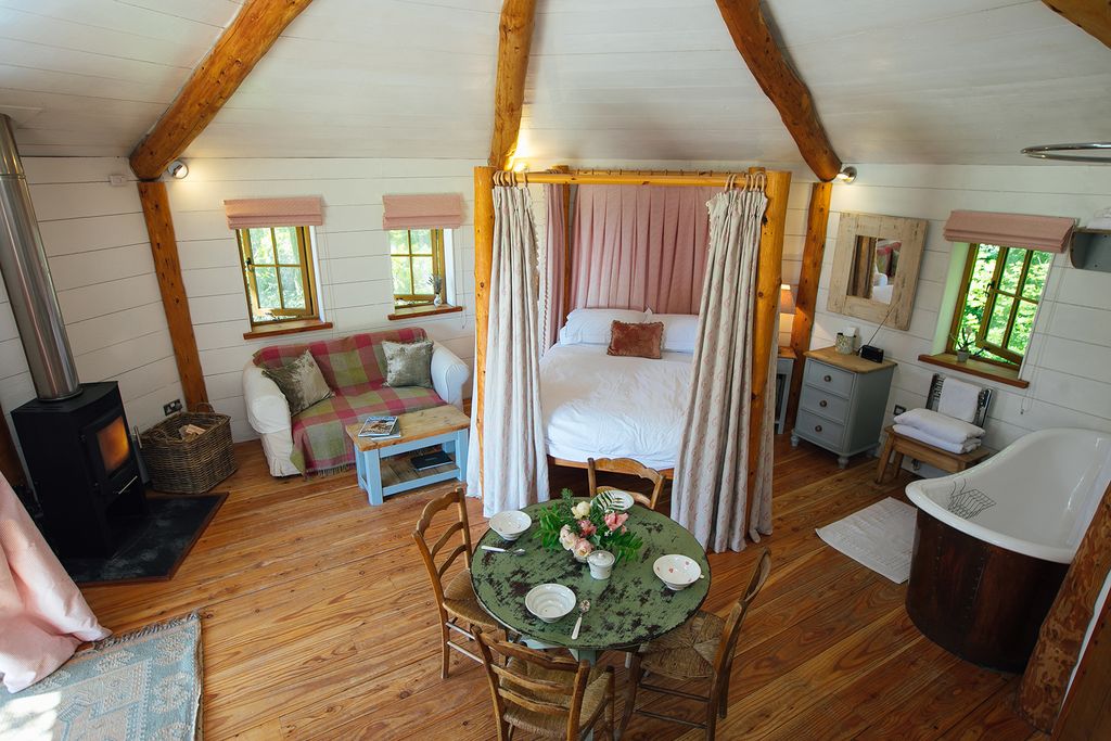 Image may contain Flooring Human Person Wood Hardwood Floor Living Room Room Indoors Furniture and Couch