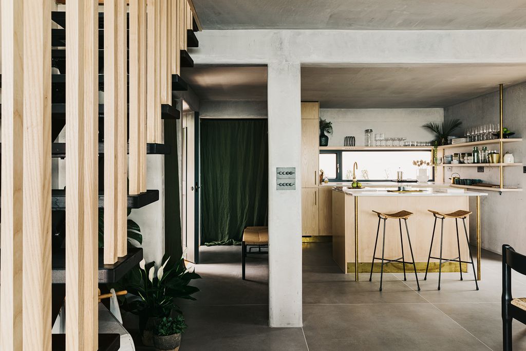 Image may contain Flooring Floor Furniture Indoors Interior Design Room Door Living Room Housing and Building