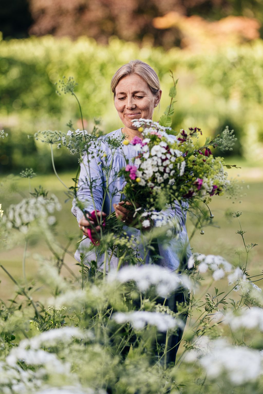 Clare gathering flowers  although she doesnt have space for a dedicated cutting garden the borders are deep enough to...