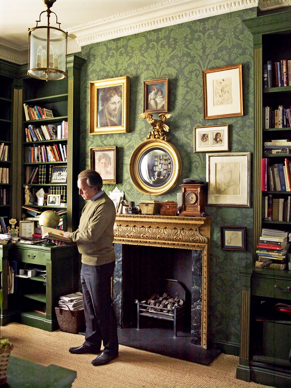 In the library Philip looks through a volume of English botany by James Sowerby  a naturalist and illustrator.