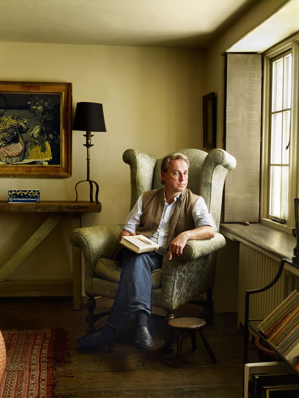 Image may contain Furniture Philip Mould Living Room Room Indoors Couch Wood Home Decor Flooring Human and Person