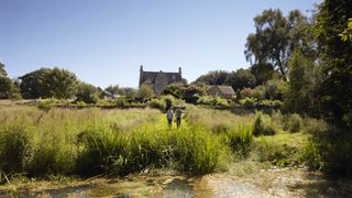 Image may contain Outdoors Nature Land Water Human Person Grassland Field Bog Swamp Marsh and Pond
