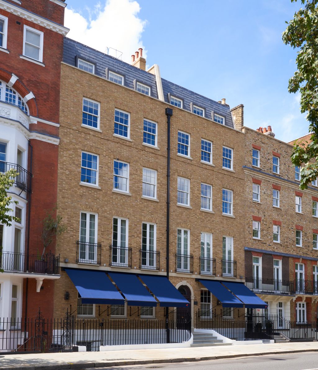 Image may contain Canopy Awning City Town High Rise Building Urban Apartment Building and Neighborhood