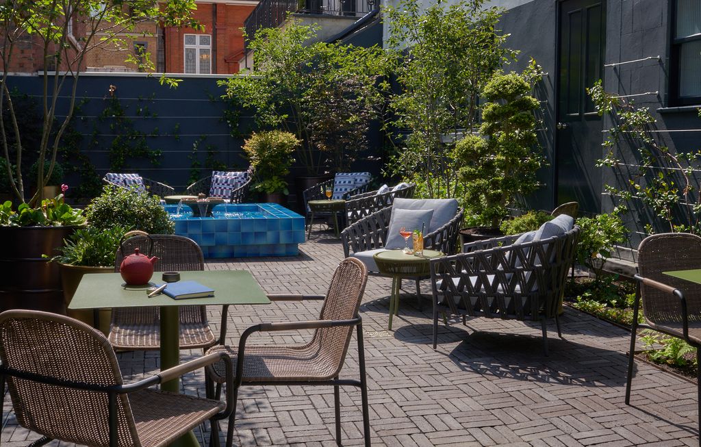 Image may contain Furniture Chair Flagstone Patio Restaurant and Outdoors