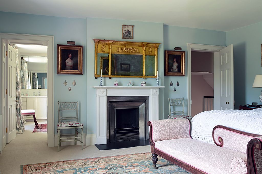 Image may contain Living Room Room Indoors Interior Design Furniture Home Decor Fireplace Couch and Hearth