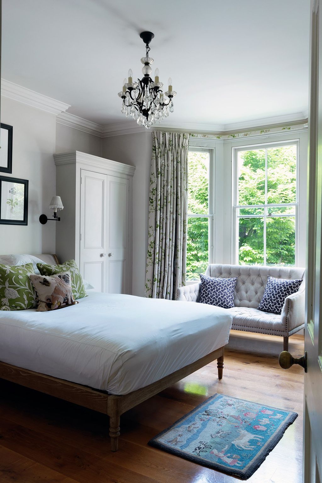 Image may contain Indoors Room Bedroom Furniture Rug Bed and Interior Design