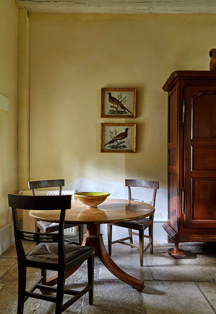 Image may contain Furniture Chair Wood Flooring Hardwood Floor Cupboard Closet and Table