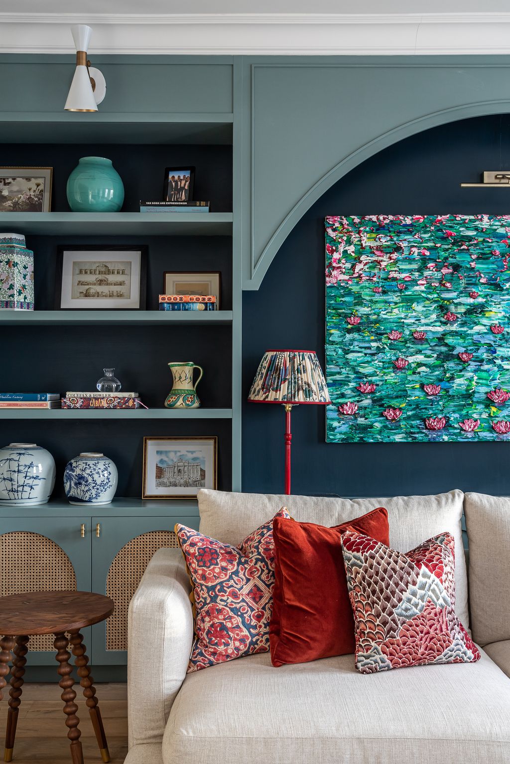 Image may contain Furniture Couch Cushion Living Room Indoors Room Pillow Chair and Shelf