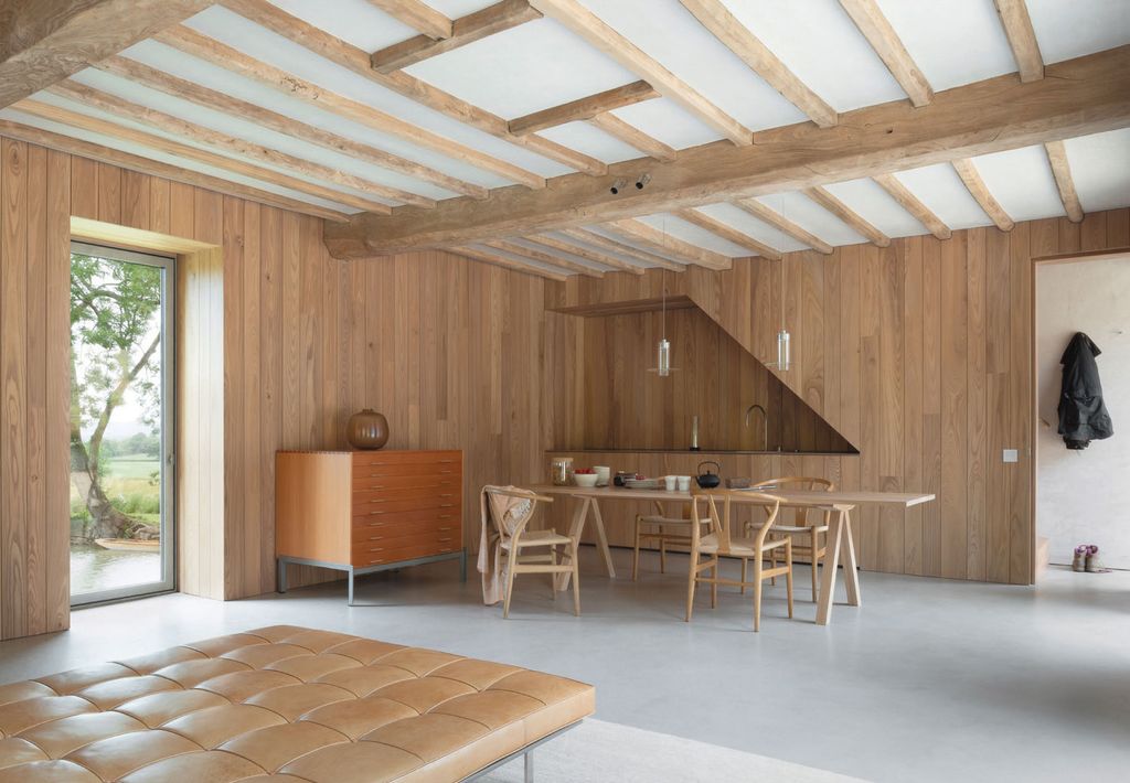 Image may contain Wood Plywood Hardwood Furniture Chair Flooring Floor Rug Housing and Building