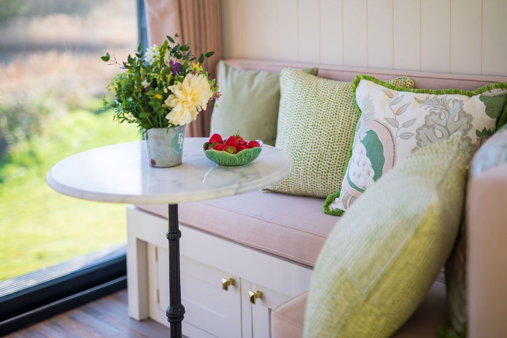 The banquette provides both a dining and lounging space with storage beneath holding a host of games as well as blankets...