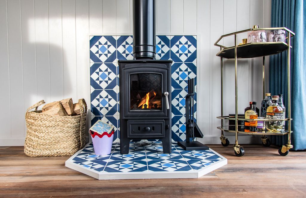 Image may contain Hearth Indoors Fireplace and Rug