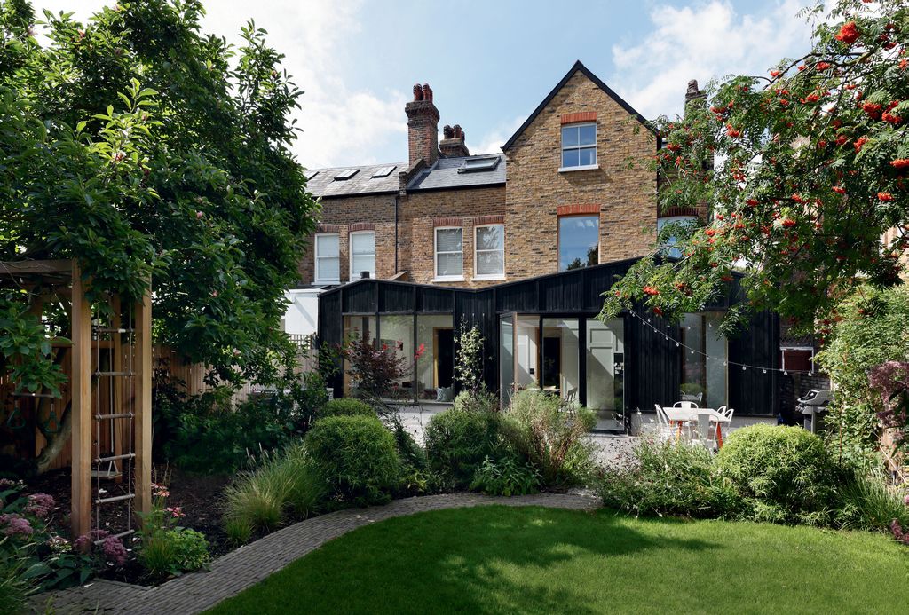 Image may contain Plant Grass Arbour Garden Outdoors Tree and Building