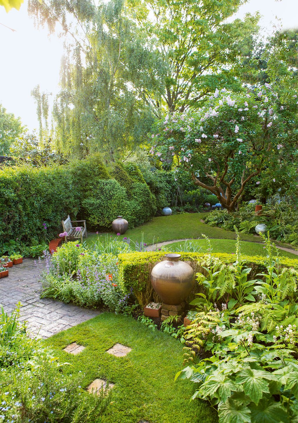 Image may contain Plant Grass Yard Outdoors Nature Garden Vase Pottery Potted Plant Jar Terrace Animal and Bird