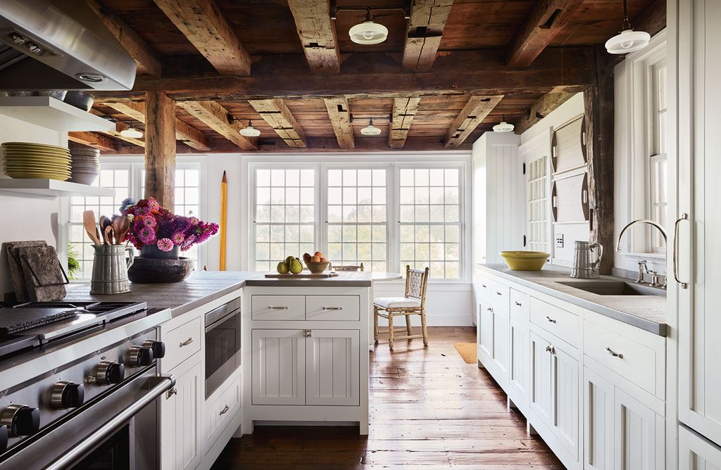 Image may contain Room Indoors Interior Design Wood Flooring Kitchen Hardwood and Plant