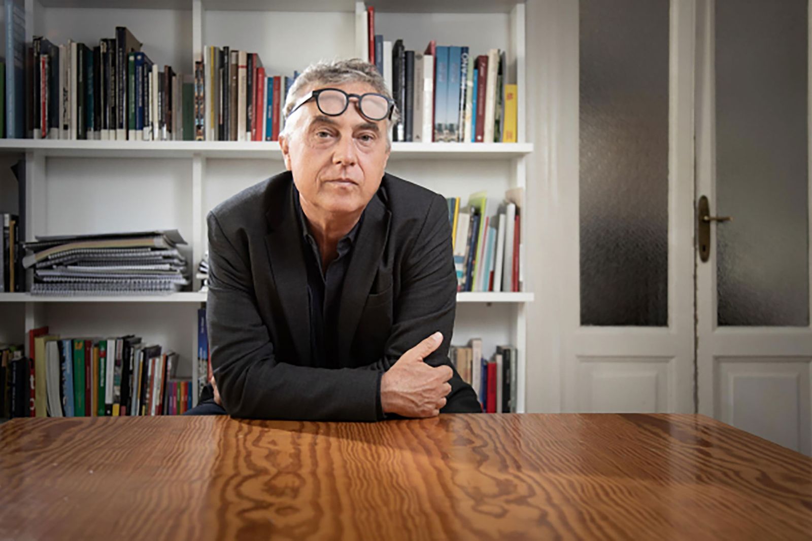 Image may contain Furniture Shelf Wood Human Person Bookcase Stefano Boeri Table Plywood and Hardwood