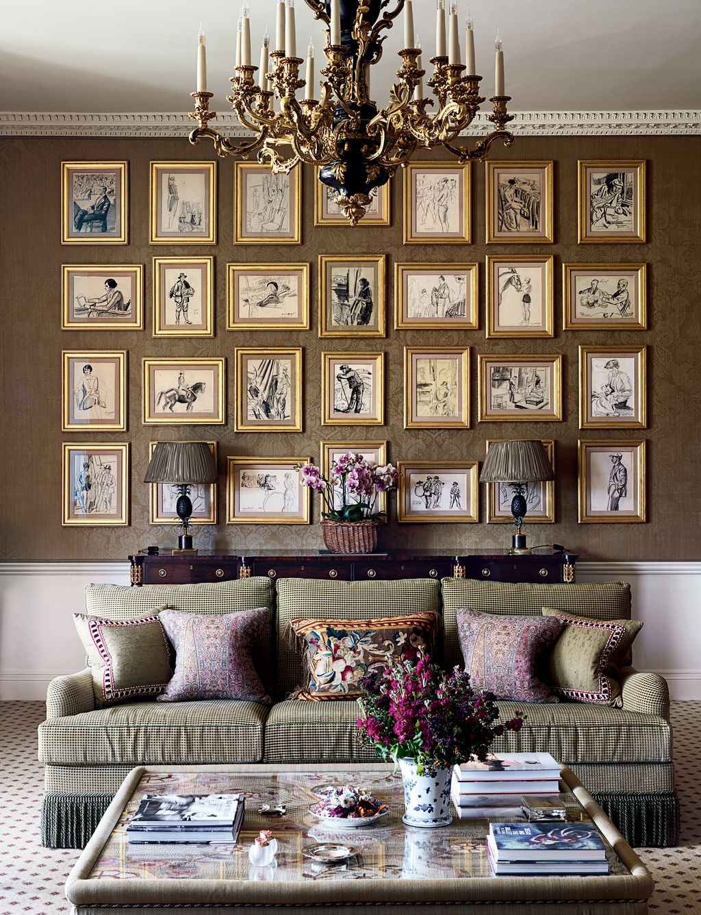 Image may contain Furniture Living Room Indoors Room Couch Lamp Chandelier Cushion Table and Rug