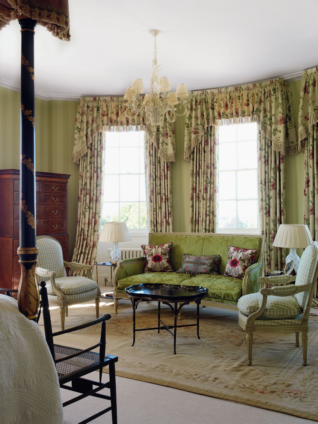 Image may contain Furniture Chair Living Room Room Indoors Couch Rug Interior Design Flooring Human and Person