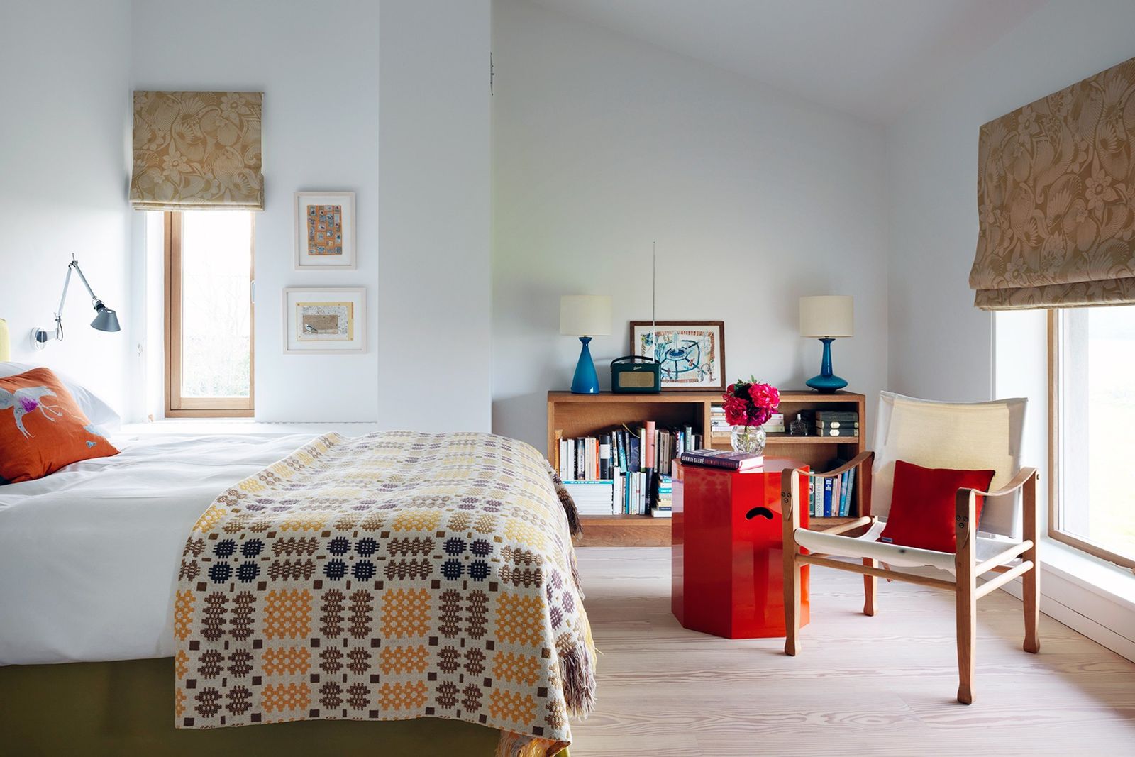 Image may contain Furniture Room Bedroom Indoors Flooring Interior Design Living Room Shelf Bed Floor and Wood