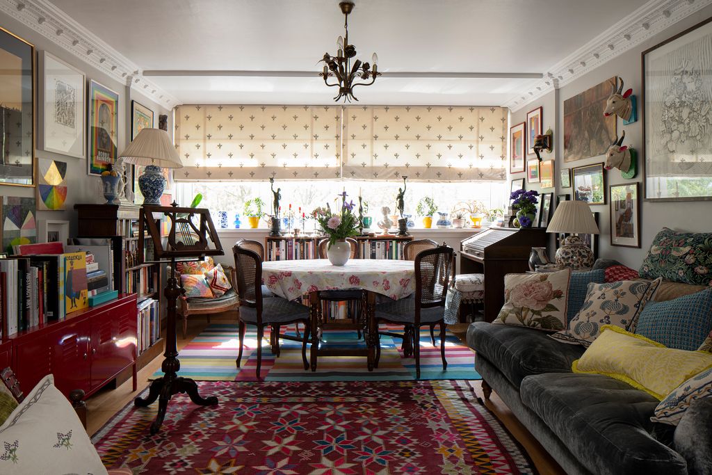 Image may contain Living Room Room Indoors Furniture Couch Flooring Interior Design Chair Rug Wood and Dining Room