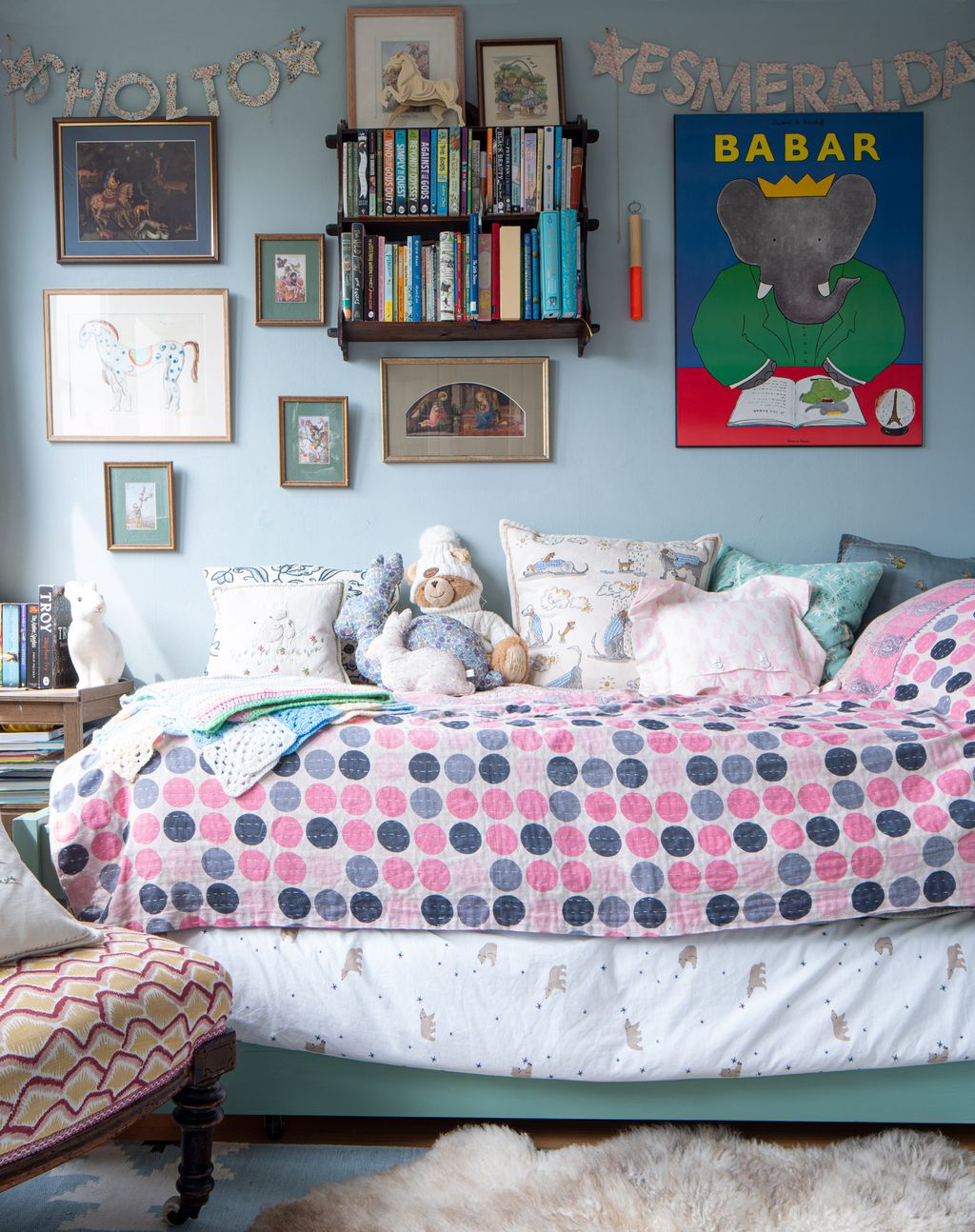 The walls are painted in Farrow Ball's 'Parma Grey' and the bed which is a trundle bed is painted in Farrow Ball's...