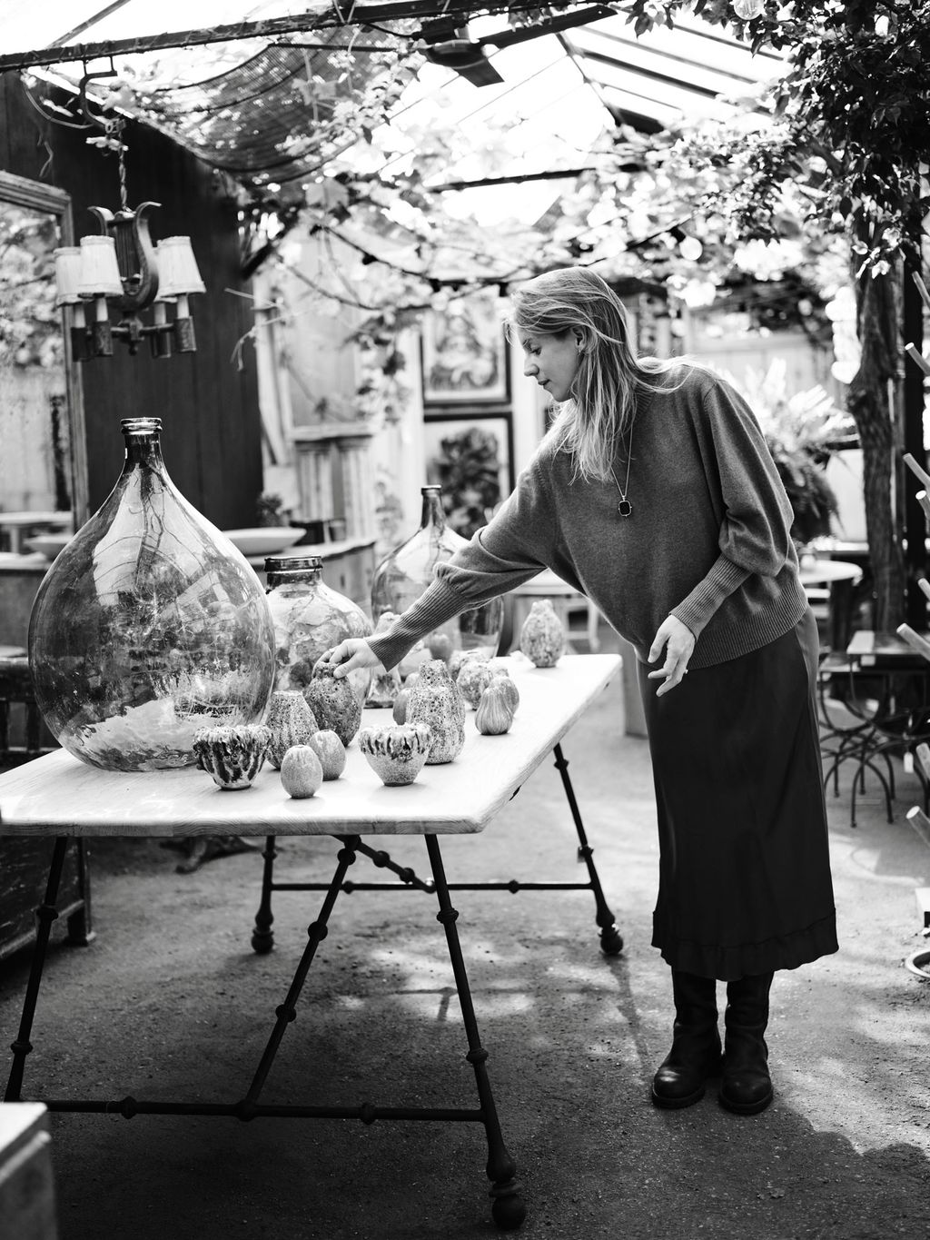 Image may contain Human Person Furniture Tabletop Clothing Apparel Table and Dining Table