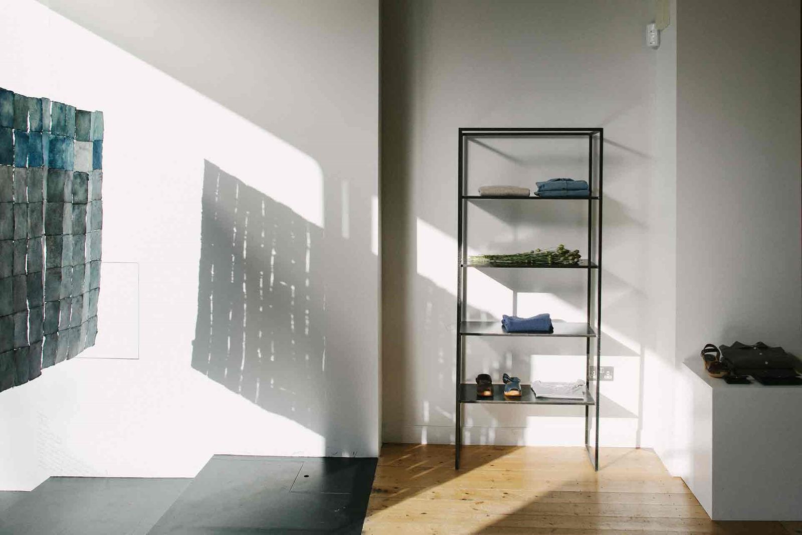 Image may contain Flooring Wood Shelf Hardwood Floor Corner Interior Design Indoors and Furniture