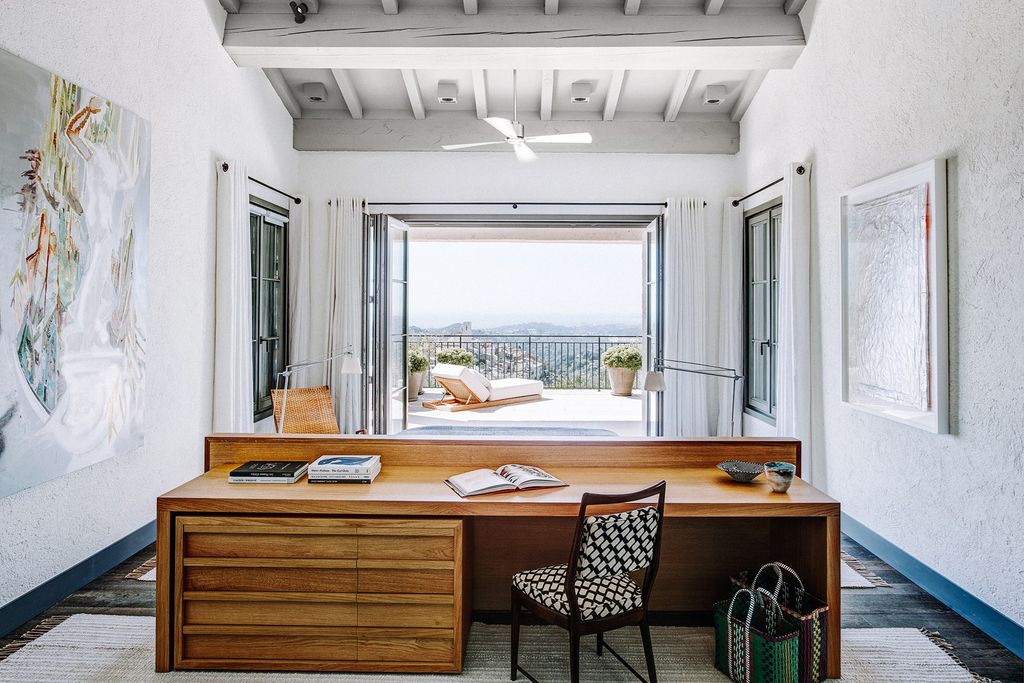 Each of the seven bedrooms including the main bedroom here has foldaway doors that open onto a balcony or the garden.