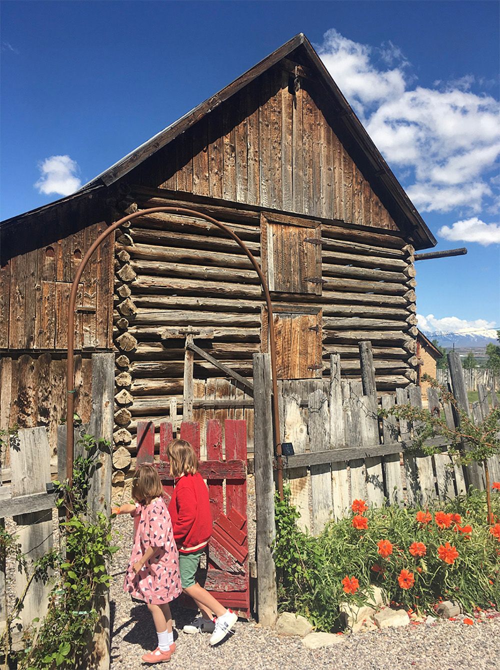 This log cabin outbuilding houses a guest room.