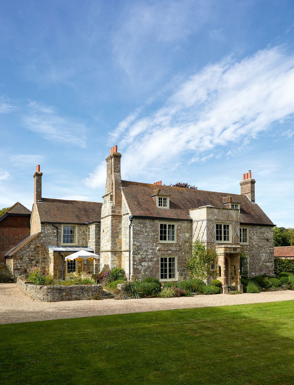 Image may contain Plant Grass Cottage House Building Housing Mansion and Roof