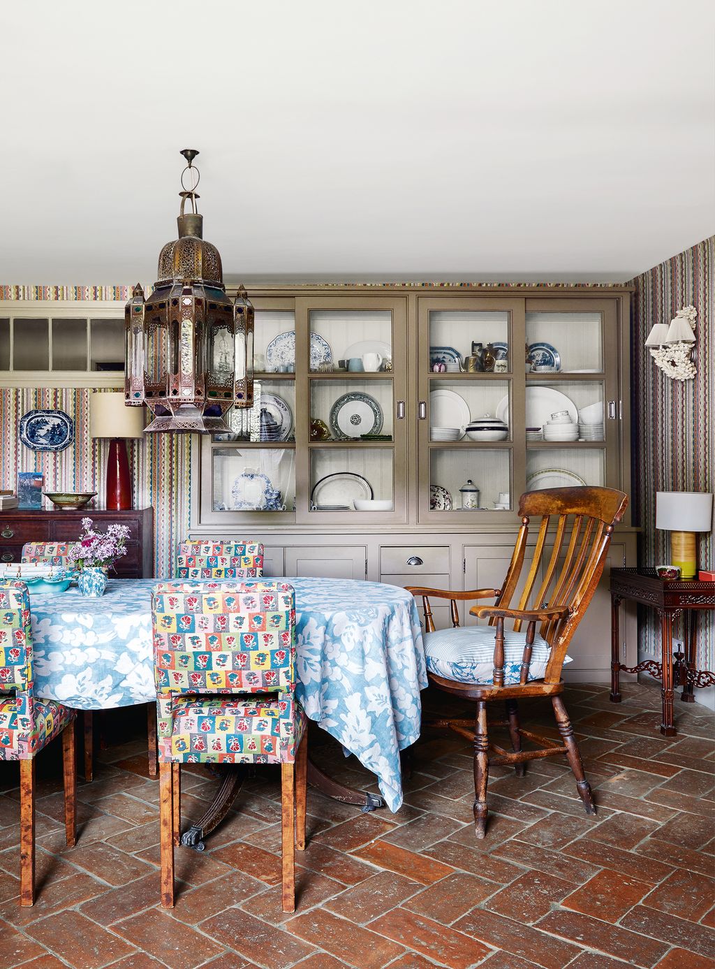 Image may contain Furniture Chair Living Room Room Indoors Interior Design Flooring Floor Shelf and Home Decor