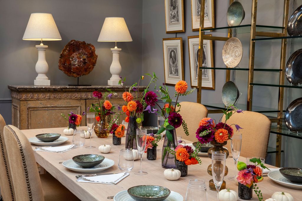 Image may contain Furniture Plant Lamp Table Lamp Table Flower Blossom Chair Dining Table and Flower Arrangement