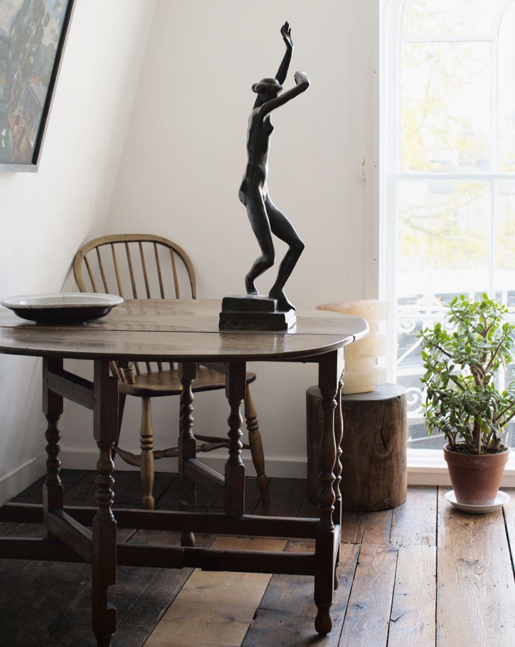 Image may contain Furniture Chair Tabletop Table Wood Human Person Dining Table Hardwood Plywood and Indoors