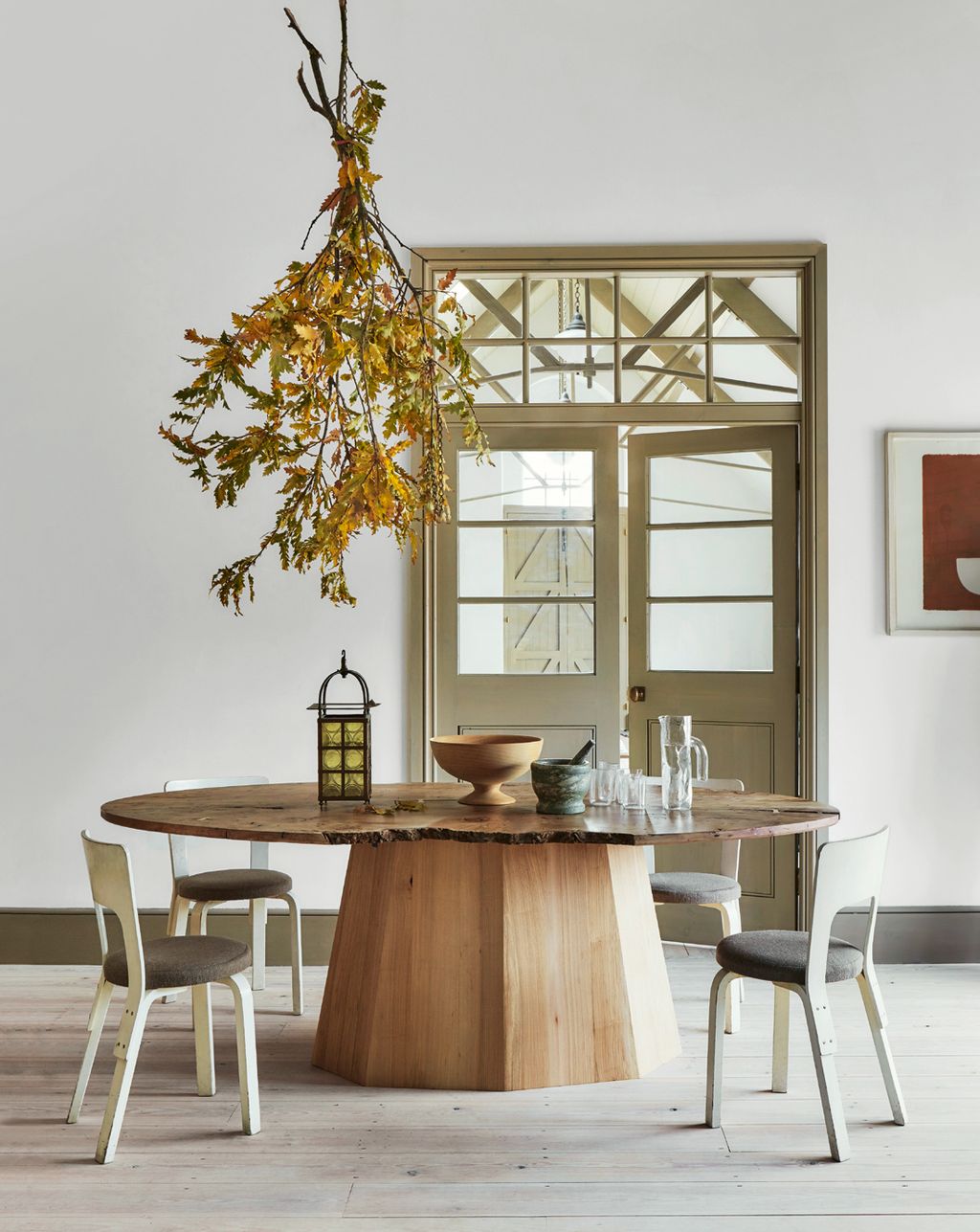 Image may contain Furniture Dining Table Table Chair Wood Tabletop Hardwood Room Indoors and Dining Room