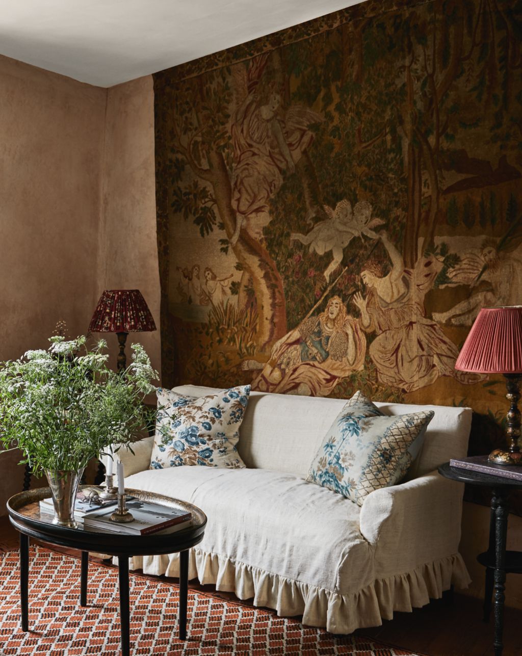 Image may contain Furniture Couch Lamp Table Lamp Living Room Indoors Room Table Cushion Pillow and Coffee Table