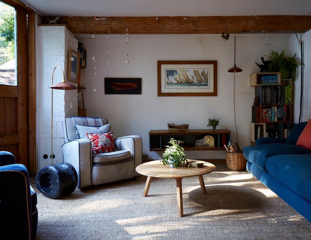 Image may contain Furniture Living Room Indoors Room Couch Table Coffee Table Rug and Interior Design