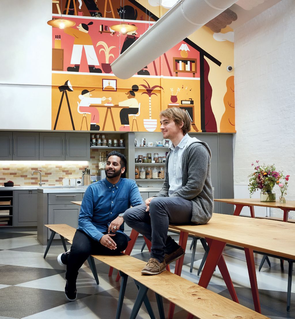 Image may contain Footwear Clothing Shoe Apparel Wood Human Person Plywood Restaurant Flooring Sitting and Cafe