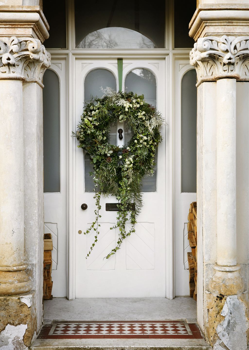 Image may contain Door Building Architecture and Wreath