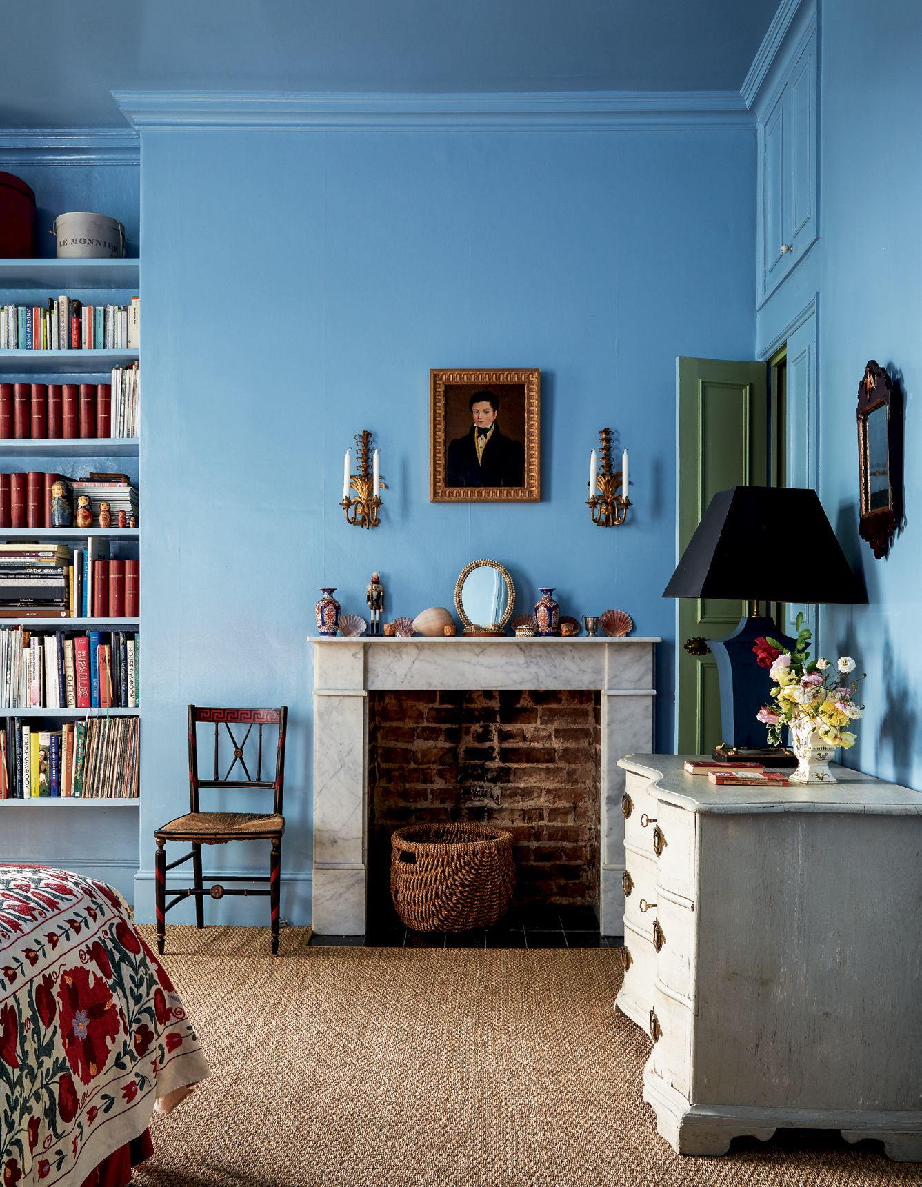 Image may contain Furniture Room Indoors Bedroom Interior Design Living Room Shelf and Bookcase