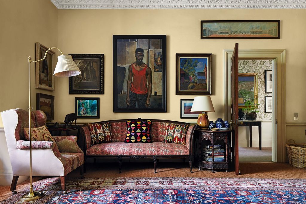 Image may contain Living Room Room Indoors Furniture Couch Human Person Flooring Interior Design and Patrick Ewing