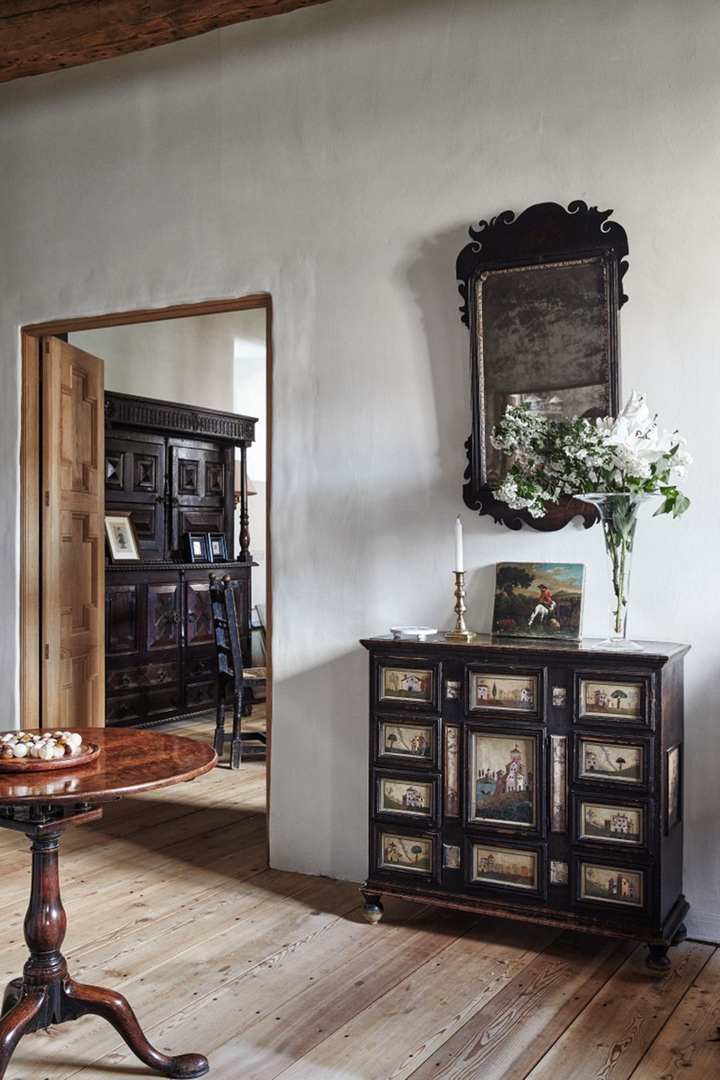 Image may contain Furniture Indoors Interior Design Cabinet Living Room Room Plant Sideboard Wood and Table